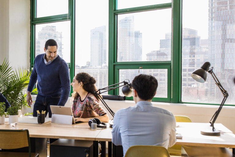 Small business team collaborating in modern workplace.