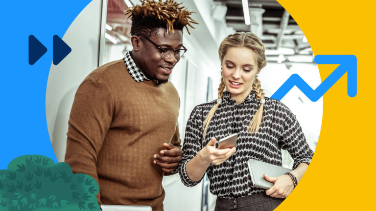 Two people talking about sales engagement while looking at a cell phone in an office setting