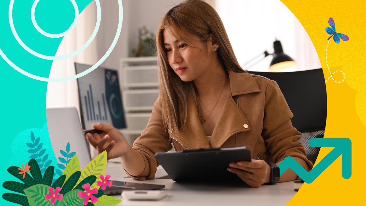 Sales person sitting at a desk and working on a computer. She is looking at spreadsheets that show competitive pricing strategies.