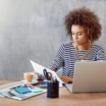 Woman reading about small business myths debunked from Salesforce trends report