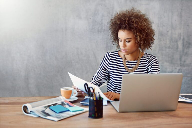 Woman reading about small business myths debunked from Salesforce trends report